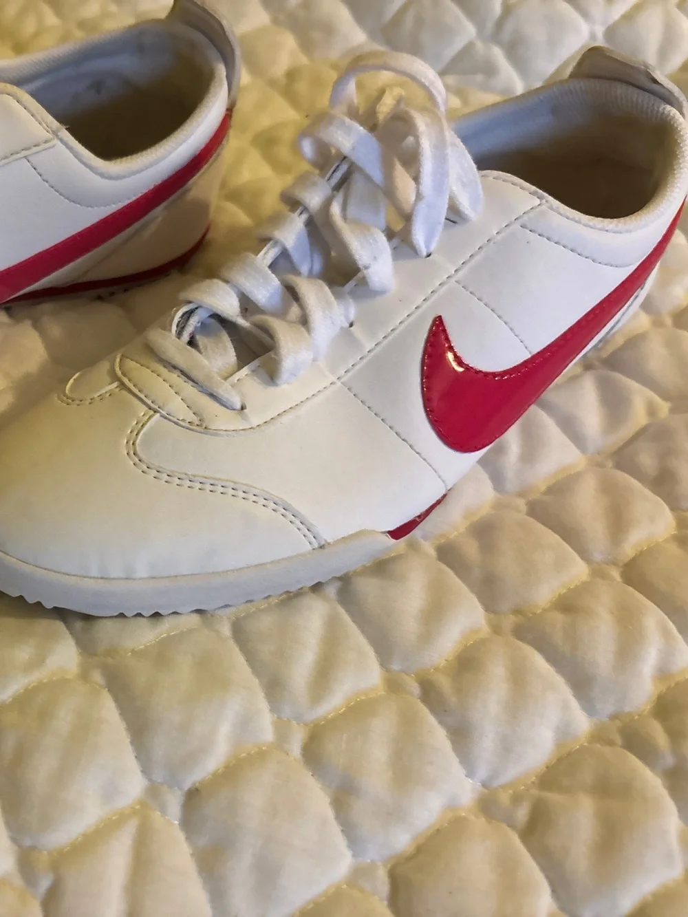 Nike White Sneakers with Pink Swoosh Accents